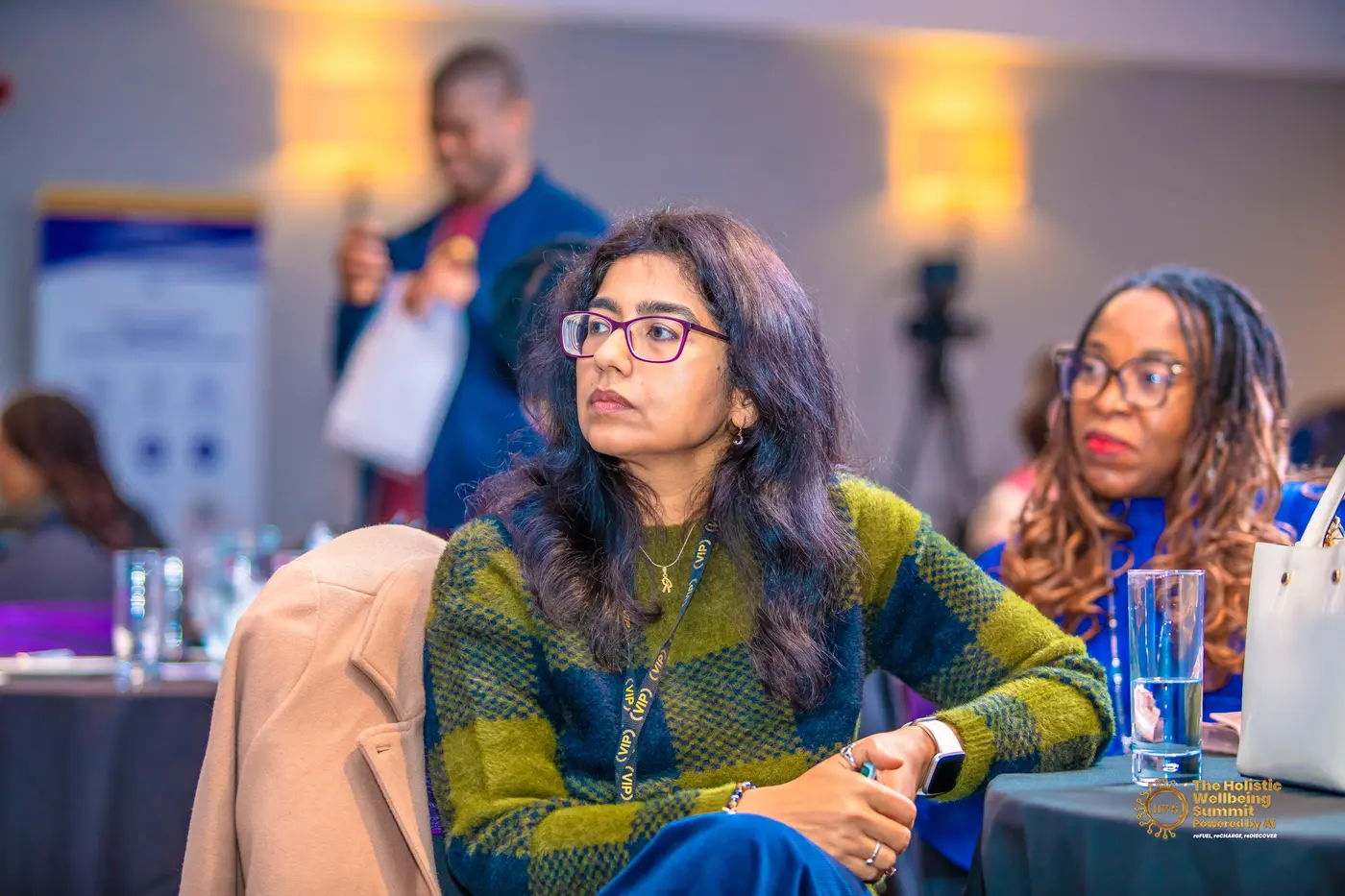 A woman listening from the floor during one of the sessions.
